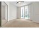 Spacious bedroom with large window and mirrored closet at 241 Riverside Drive # 409, Daytona Beach, FL 32117