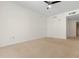 Bright and airy bedroom with ceiling fan and carpet at 241 Riverside Drive # 409, Daytona Beach, FL 32117