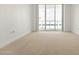 Bedroom with large windows and access to balcony at 241 Riverside Drive # 409, Daytona Beach, FL 32117