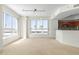 Bright dining area with large windows and access to kitchen at 241 Riverside Drive # 409, Daytona Beach, FL 32117