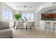 Modern dining room with large windows and seating for six at 241 Riverside Drive # 409, Daytona Beach, FL 32117