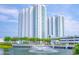 Luxury high-rise building with water fountain and landscaping at 241 Riverside Drive # 409, Daytona Beach, FL 32117