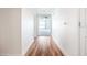 Bright hallway with wood-look flooring leads to living spaces at 241 Riverside Drive # 409, Daytona Beach, FL 32117