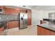 Modern kitchen with stainless steel appliances and mosaic backsplash at 241 Riverside Drive # 409, Daytona Beach, FL 32117