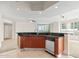 Kitchen island with granite countertop and modern appliances at 241 Riverside Drive # 409, Daytona Beach, FL 32117