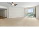 Spacious living room with large windows offering scenic views and hardwood floors at 241 Riverside Drive # 409, Daytona Beach, FL 32117