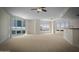 Bright living room with large windows and balcony access at 241 Riverside Drive # 409, Daytona Beach, FL 32117