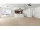 Spacious living room with carpet flooring and ceiling fan at 241 Riverside Drive # 409, Daytona Beach, FL 32117