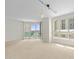 Living room with large windows and track lighting, overlooking the water at 241 Riverside Drive # 409, Daytona Beach, FL 32117