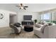 Bright living room with city views, featuring a curved sofa and ample natural light at 241 Riverside Drive # 409, Daytona Beach, FL 32117