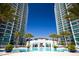 Resort-style pool area with two high-rise buildings in the background at 241 Riverside Drive # 409, Daytona Beach, FL 32117