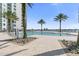 Enjoy the resort-style pool with a view of the water and the building at 241 Riverside Drive # 409, Daytona Beach, FL 32117