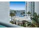 Balcony view of waterfront, pool, and surrounding buildings at 241 Riverside Drive # 409, Daytona Beach, FL 32117