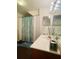 Double vanity bathroom with updated fixtures and decor at 2600 Lodi Cir # 101, Kissimmee, FL 34746