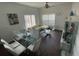 Bright living room features a glass dining table and comfy seating at 2600 Lodi Cir # 101, Kissimmee, FL 34746