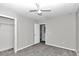 Well-lit bedroom with ceiling fan and closet at 2718 Se 45Th Ave, Ocala, FL 34480