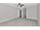 Large bedroom with ceiling fan and gray carpeting at 2718 Se 45Th Ave, Ocala, FL 34480