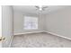 Simple bedroom with gray carpet and window coverings at 2718 Se 45Th Ave, Ocala, FL 34480