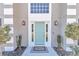 Charming teal front door with sidelights and a welcome mat at 2718 Se 45Th Ave, Ocala, FL 34480