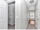 Simple hallway with gray walls, carpet, and window at 2718 Se 45Th Ave, Ocala, FL 34480