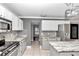 Modern kitchen with island, stainless steel appliances, and granite countertops at 2718 Se 45Th Ave, Ocala, FL 34480