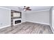 Spacious living room with fireplace and wood-look flooring at 2718 Se 45Th Ave, Ocala, FL 34480