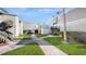 Community courtyard with walkways and landscaping at 273 Scottsdale Sq # 273, Winter Park, FL 32792