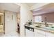 Efficient kitchen features a built-in dishwasher and ample counter space at 273 Scottsdale Sq # 273, Winter Park, FL 32792
