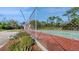 Community tennis court with chain link fence at 273 Scottsdale Sq # 273, Winter Park, FL 32792