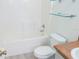 Clean bathroom with updated vanity and glass shelves at 308 Robin Rd, Davenport, FL 33896