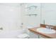 Clean bathroom with updated vanity and glass shelves at 308 Robin Rd, Davenport, FL 33896
