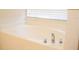 Oval garden bathtub with chrome fixtures at 308 Robin Rd, Davenport, FL 33896