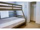 Bedroom with bunk bed and double closet at 308 Robin Rd, Davenport, FL 33896