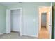 Bedroom with closet and access to hallway at 308 Robin Rd, Davenport, FL 33896