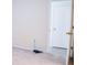 Empty bedroom with carpet and door to hallway at 308 Robin Rd, Davenport, FL 33896