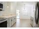 Bright kitchen with light cabinets and stainless steel appliances at 308 Robin Rd, Davenport, FL 33896