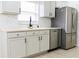 Modern kitchen with stainless steel appliances and light cabinets at 308 Robin Rd, Davenport, FL 33896