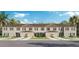 Three-unit townhome building with attached garages and landscaping at 3326 Private Oak Dr, Apopka, FL 32703