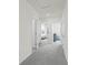 Bright hallway with carpeted floor and doors to bedrooms at 3326 Private Oak Dr, Apopka, FL 32703