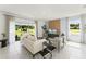 Bright living room with sliding glass doors and neutral color palette at 3326 Private Oak Dr, Apopka, FL 32703