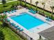 Community pool with surrounding lounge chairs at 3326 Private Oak Dr, Apopka, FL 32703