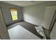 Bright bedroom with gray walls, carpeting, and a window at 3548 Valley Trl, Lakeland, FL 33810