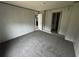 Spacious bedroom with gray walls and gray carpeting at 3548 Valley Trl, Lakeland, FL 33810