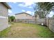 Backyard view with wooden fence at 430 Magpie Ct, Kissimmee, FL 34759