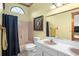 Bathroom with double vanity, a shower/tub combo, and neutral color palette at 430 Magpie Ct, Kissimmee, FL 34759