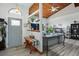 Bright entryway with wood-look floors, a gray door and bench at 430 Magpie Ct, Kissimmee, FL 34759