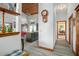 Bright hallway with wood-look flooring and views into the living and kitchen areas at 430 Magpie Ct, Kissimmee, FL 34759