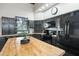 Updated kitchen with dark cabinets, stainless steel appliances and a large island at 430 Magpie Ct, Kissimmee, FL 34759