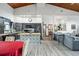 Open kitchen features a large island, modern appliances, and wood-look flooring at 430 Magpie Ct, Kissimmee, FL 34759