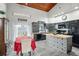 Modern kitchen with dark cabinets, stainless steel appliances and an island at 430 Magpie Ct, Kissimmee, FL 34759